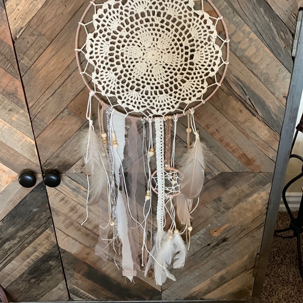 Beautiful BOHO dream catcher. Leather hook added so you can easily hang it.